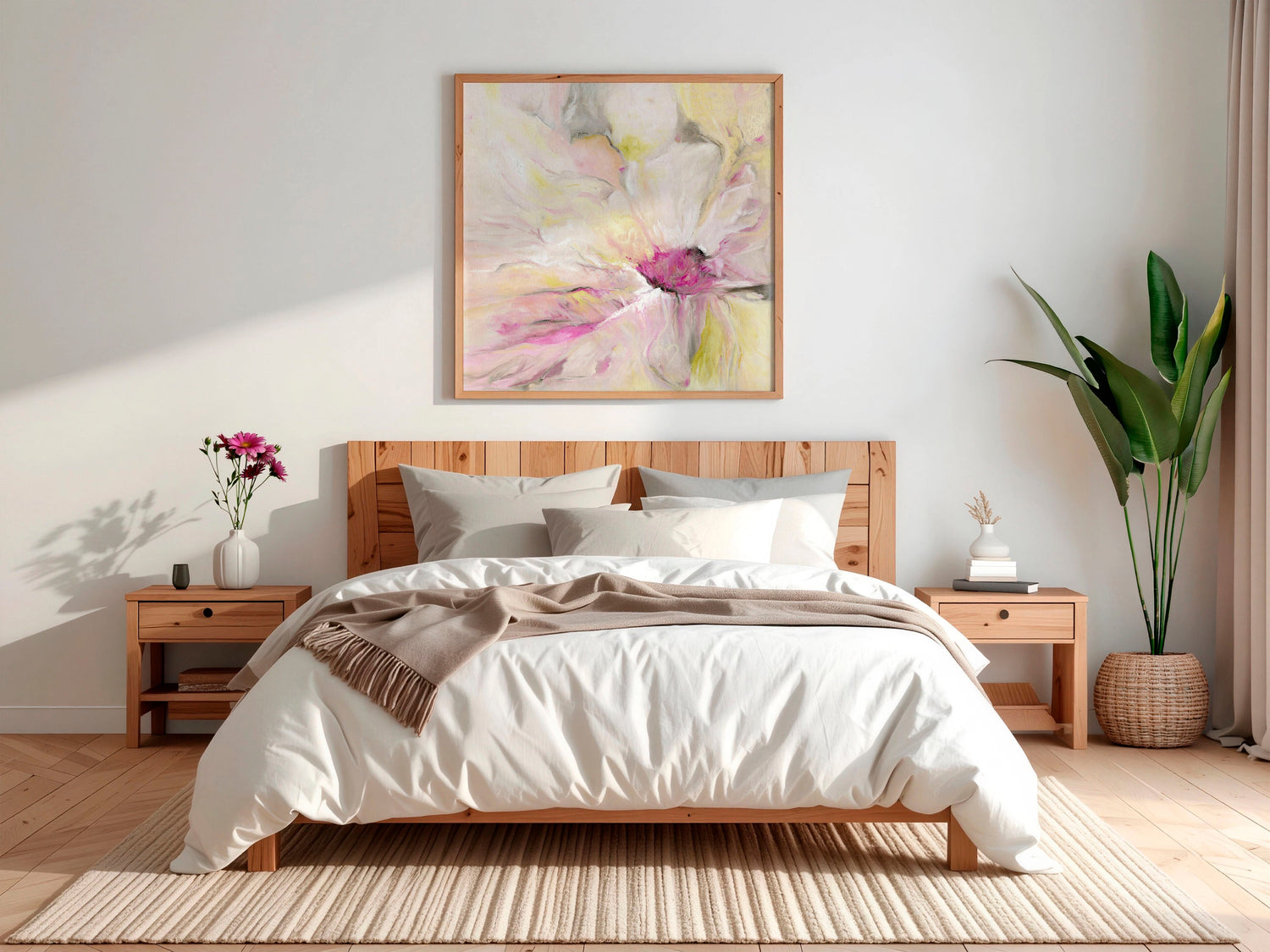 Pink wall art for bedroom — framed abstract floral canvas print in soft blush pink and sage green displayed above a headboard, beautiful feminine bedroom wall art by Kate Shephard Art.