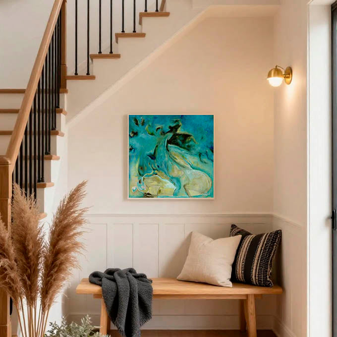 Wall art for stairs — framed abstract canvas print in deep blues and teal displayed beneath a beautiful staircase, striking beautiful wall art for stairs by Kate Shephard Art.