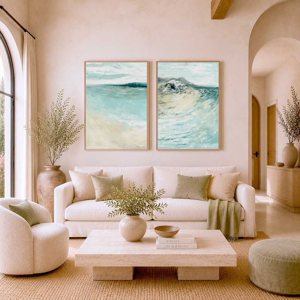 'Coastal Calm' - Beach art paintings set of 2 prints hung together on a white wall, soft blue and teal coastal home decor.