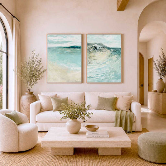 'Coastal Calm' - Beach art paintings set of 2 prints hung together on a white wall, soft blue and teal coastal home decor.